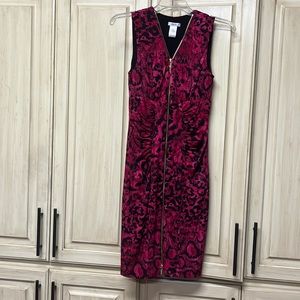 Form fitting pink animal print w front zipper.